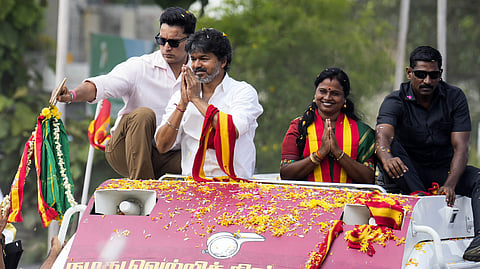 Tamil Nadu Chief Minister and TVK President C Joseph Vijay greets the crowd during a roadshow in the Madurantakam constituency ahead of the upcoming assembly bypolls on October 6, in Chennai on Friday, Oct. 02, 2026.