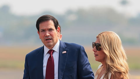 US Secretary of State Marco Rubio and his wife Jeanette Rubio walk before boarding a plane en route to Jamnagar, India, at Chhatrapati Shivaji Maharaj International Airport in Mumbai, India, Wednesday, Oct. 21, 2026.