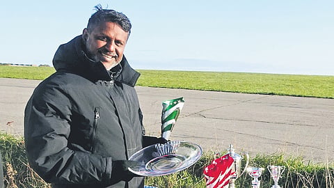 Jobin with medals he won in the UK national paragliding accuracy championships