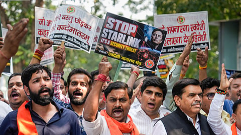 Swadeshi Jagran Manch (SJM) members hold placards during a protest march against Starlink, the satellite-based internet service owned by industrialist Elon Musk, in New Delhi, Friday, Oct. 23, 2026.
