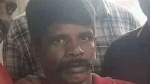Police securing R Suresh, one of the escapees.
