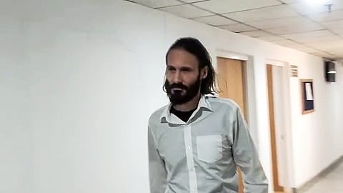 US national Matthew Aaron Vandyke arrives at Delhi's Rouse Avenue Court to appear before the NIA court in the Myanmar training camp case in New Delhi on Friday, Oct. 23, 2026.