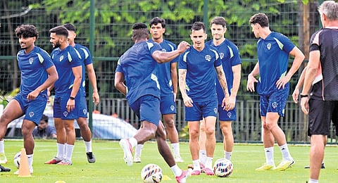 The Kerala Blasters team, set to face Mumbai City FC in an ISL football match on Sunday, training at Charter School football ground in Pookattupady 