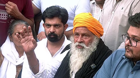 In this photo from Oct. 14, 2026, Bhim Singh, father of anti-drug activist Parvinder Singh Jhota, who was shot dead, addresses a press conference in Mansa.