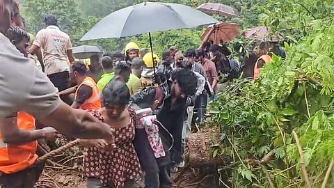 School students being rescued after their bus gets stranded in a mudslide on the Mettupalayam-Ooty road amid heavy rainfall in Tamil Nadu, Saturday, Oct. 24, 2026.