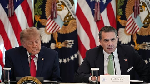 US President Donald Trump listens as Attorney General Todd Blanche speaks at a roundtable event in the East Room of the White House, Wednesday, Oct. 21, 2026, in Washington. 