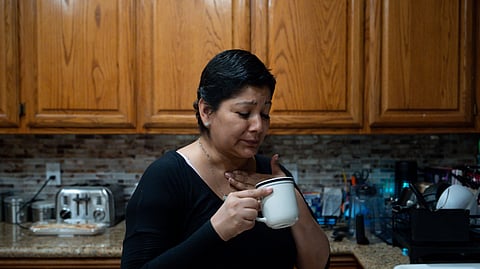 Cindy Banda drinks a home remedy after experiencing side effects from the targeted therapy pill Kisqali, Sept. 16, 2026, at her house in McAllen, Texas.