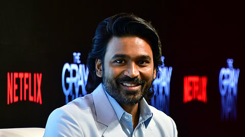 In this file photo from July 21, 2022, actor Dhanush speaks during a press conference in Mumbai.