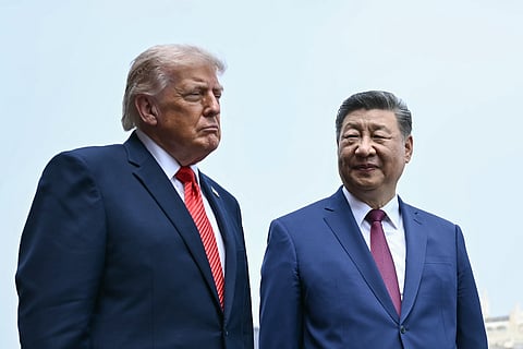 China's President Xi Jinping, right, and U.S. President Donald Trump visit the Temple of Heaven in Beijing, May 14, 2026.