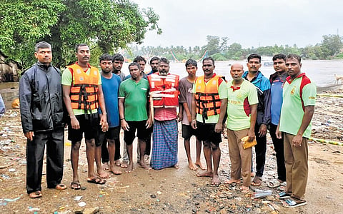 The nine workers who were rescued after being stranded Vellaru River in Perambalur on Sunday 