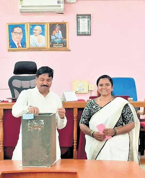 Minister Rudrappa Lamani (left) with the woman accused of casting a bogus vote in Haveri on Saturday  