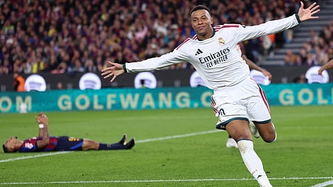 Real Madrid's Kylian Mbappe celebrates scoring his team's second goal during the Spanish league football match between FC Barcelona and Real Madrid CF at Camp Nou Stadium in Barcelona on October 25, 2026.