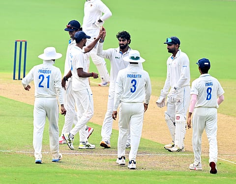 Sonu Yadav celebrates a wicket with teammates