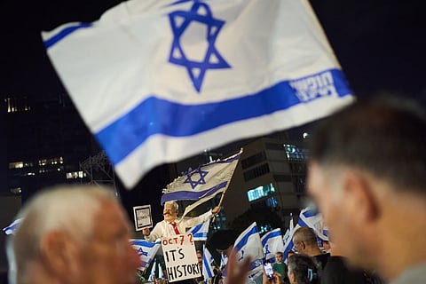 A demonstrator wearing a mask depicting Israeli Prime Minister Benjamin Netanyahu attends an anti-government protest ahead of Israel's general election, Saturday, Oct. 24, 2026, in Tel Aviv, Israel. 