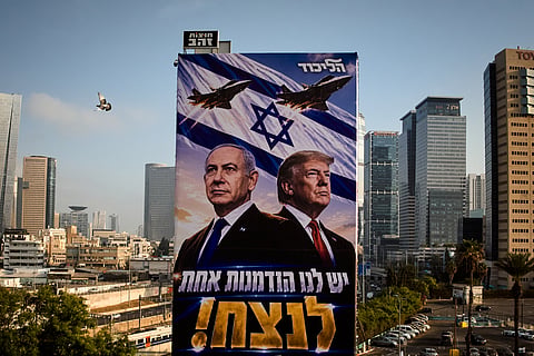 A pigeon flies past a Likud Party campaign billboard featuring U.S. President Donald Trump and Israeli Prime Minister Benjamin Netanyahu, with a Hebrew message reading, "We have one opportunity to win," in Tel Aviv, Israel, Monday, Oct. 26, 2026.