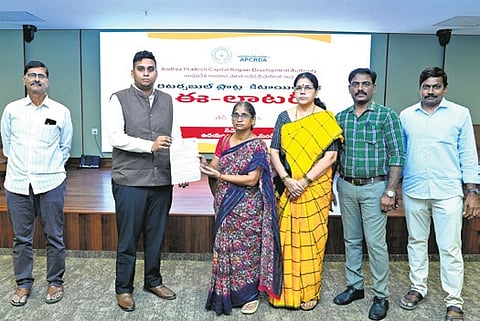APCRDA officials distribute provisional allotment certificates to beneficiaries  in Amaravati on Tuesday.