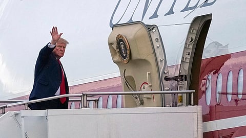 President Donald Trump waves as he boards Air Force One, Sunday, Oct. 25, 2026, at Selfridge Air National Guard Base, Mich.