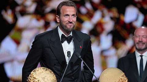 England's soccer player Harry Kane wins the trophy for striker of the year during the Ballon d'Or ceremony at the London Palladium Theatre in London, England, Monday, Oct. 26, 2026 