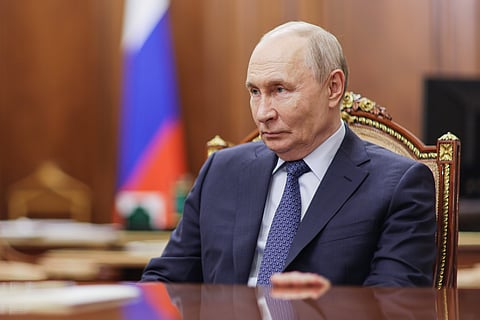 Russian President Vladimir Putin speaks with Gazprombank CEO Andrei Akimov during their meeting at the Kremlin in Moscow, Monday, Oct. 26, 2026.