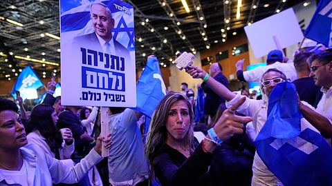 Supporters of Israeli Prime Minister Benjamin Netanyahu celebrate at Likud party headquarters in Jerusalem following the release of the first exit poll results in Israel's general election Wednesday, Oct. 28, 2026.