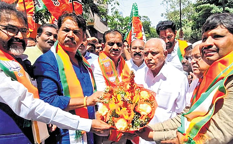 BJP leaders, including LoPs Chalavadi Narayanaswamy and R Ashoka, Chitradurga MP Govind Karjol, former CM BS Yediyurappa and others celebrate with the newly elected NDA MLCs, at the BJP office in Bengaluru on Wednesday. 