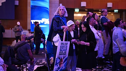 Supporters wait for the arrival of Israel's Prime Minister Benjamin Netanyahu at the election night rally after the first exit polls were announced, in Jerusalem on early October 28, 2026, during Israel's legislative elections.