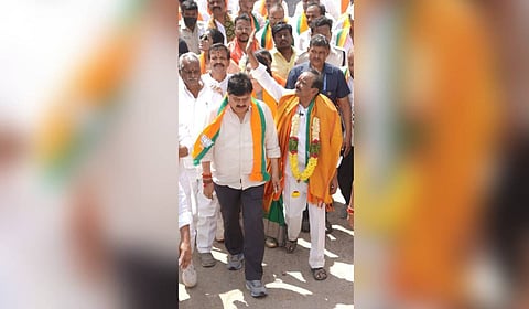 BJP leaders Eatala Rajendar and 
N Ramchander Rao during a padayatra in Hyderabad on Tuesday.