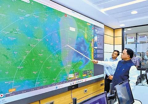 Chief Minister Mohan Charan Majhi takes stock of preparedness for cyclone Arnab at SRC control room on Wednesday. SRC Rajesh Prabhakar Patil is also seen 