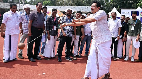 Education Minister N Samsudheen, who visited the NIT stadium, Chathamangalam, to review the arrangements for the 68th State School Sports Meet observing the hammer throw technique.