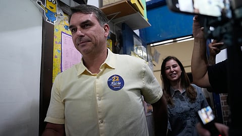 Opposition presidential candidate Sen. Flavio Bolsonaro arrives to vote in the presidential runoff in Rio de Janeiro, Sunday, Oct. 25, 2026. 