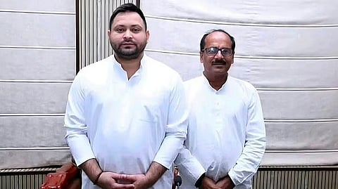 RJD-backed candidate Anil Kumar Jha with Tejashwi Yadav