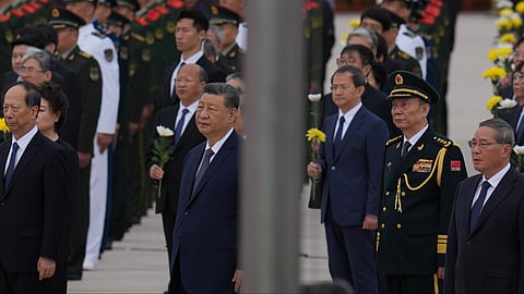 Chinese President Xi Jinping, center left and Zhang Shengmin, Vice Chairman of the Central Military Commission second from right attend a ceremony in honor of fallen national heroes at the Monument to the People's Heroes to mark Martyrs' Day at Tiananmen Square in Beijing, Wednesday, Sept. 30, 2026.