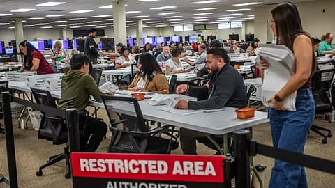 Workers prepare ballots to be scanned for counting in the Vote-By-Mail Ballot Processing-Boards at the Orange County Registrar of Voters Facility on October 28, 2026 in Santa Ana, California.