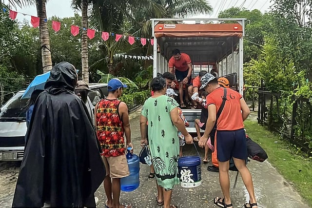 Tens of thousands of people evacuate to safety as typhoon approaches ...