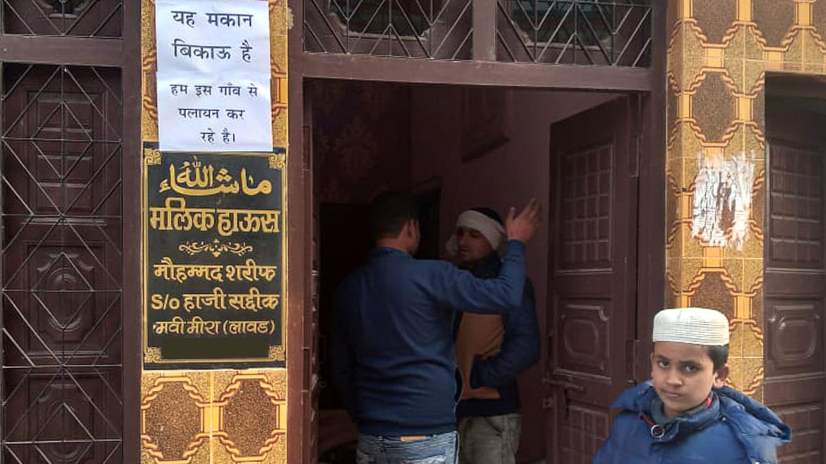 One of the Muslim houses with the notice declaring that it's up for sale.