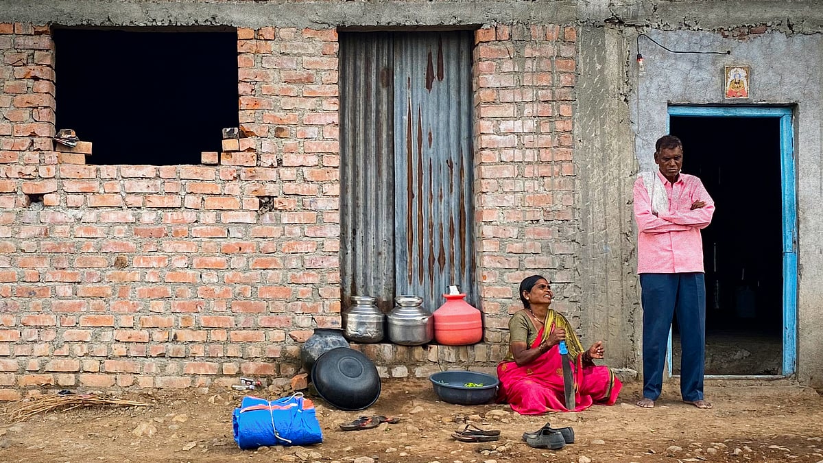 Kusumbai Pandurang Parve and her husband outside their house in Beed's Dhakephal.