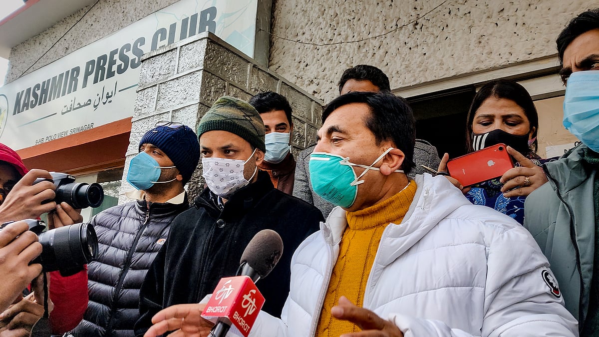 Saleem Pandit (in a white jacket) announcing the takeover of the Kashmir Press Club.