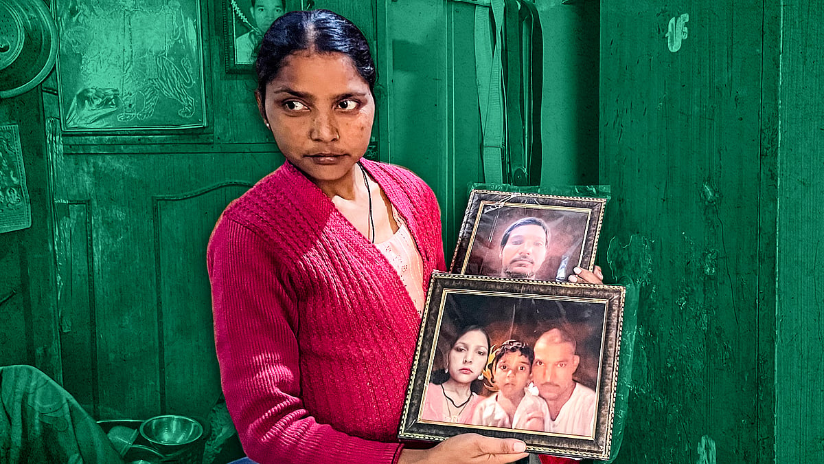 Rohit’s wife Pinky with photos of her husband. Rohit died on September 9.