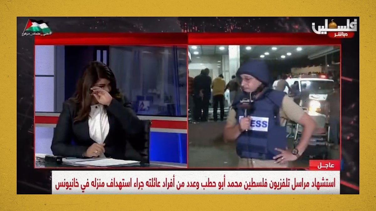 A screengrab of the video of two journalists breaking down on air.