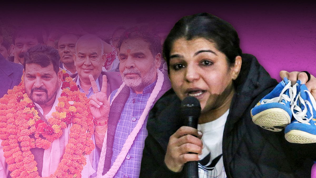 Sakshi Malik at her press conference, with an imageof Brij Bhushan Singh in the background.