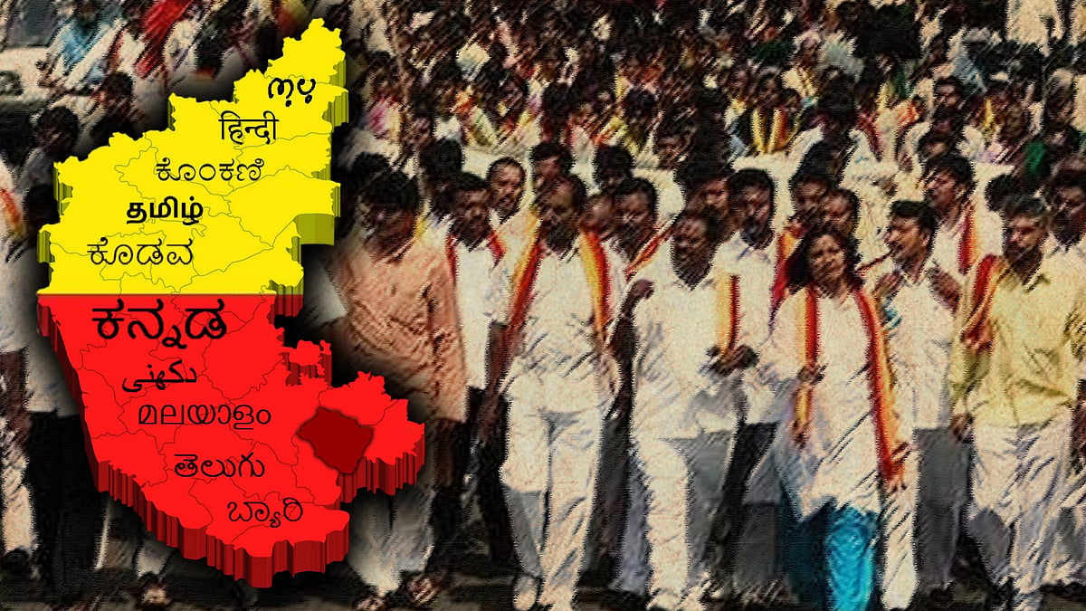 Protesters alongside a map of Karnataka that has the names of the languages spoken in the state.