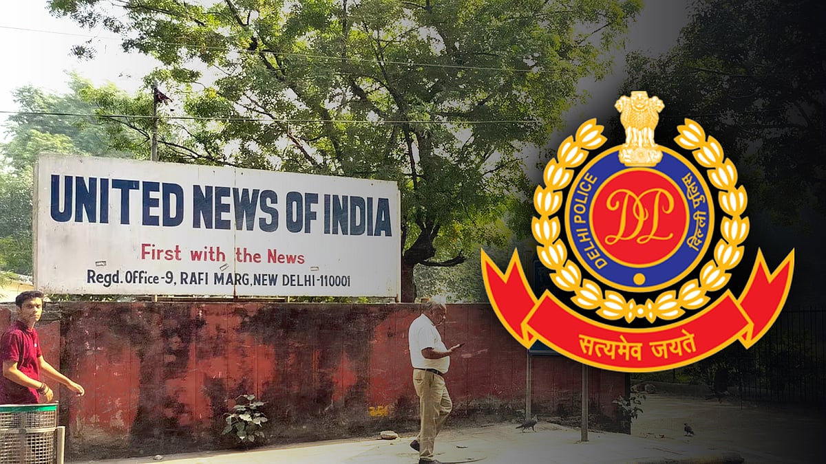 यूएनआई के दफ्तर की तस्वीर. साथ में दिल्ली पुलिस का लोगो