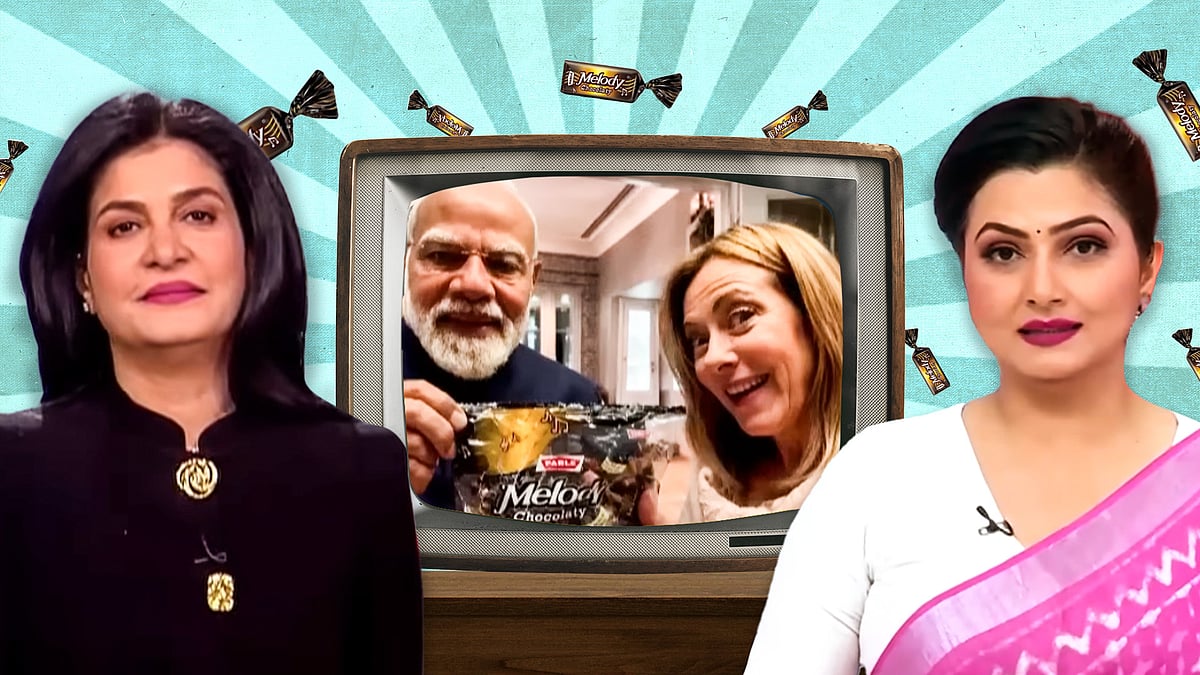 Cutouts of Anjana Om Kashyap and Chitra Tripathi with a TV set between them containing that viral Modi-Meloni moment. 