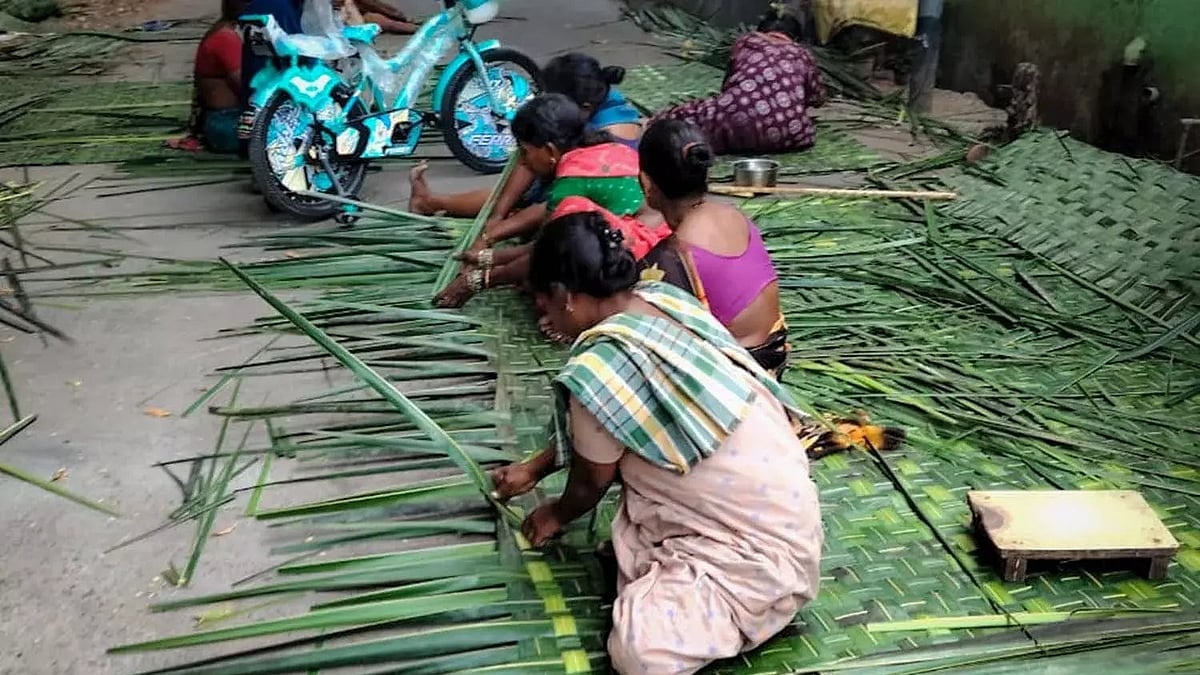 Women working under tree shade in New Raja Rajeshwari Peta.