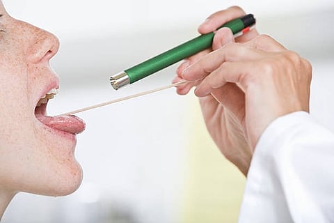 doctor check tongue