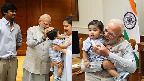 ഓമി‌ക്കൊപ്പം പ്രധാനമന്ത്രി നരേന്ദ്ര മോദി