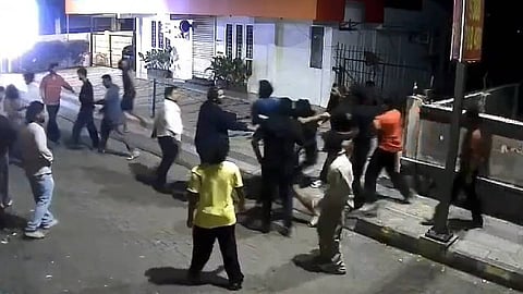 Drug mafia gang strikes man on the head with a soda bottle