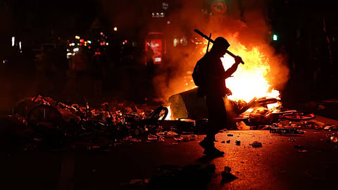 France urges curfews in some areas after weekend riots