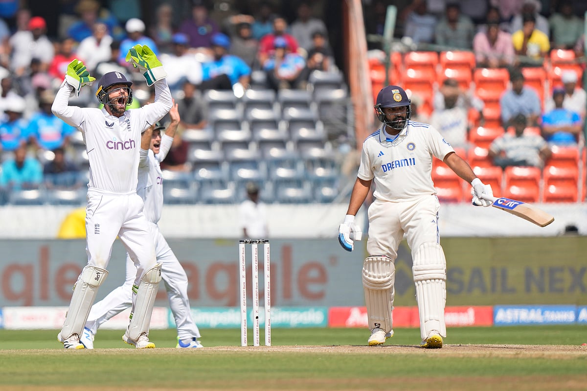 Mahesh Kumar A. : England's Ben Foakes appeals successfully for the wicket of India's Rohit Sharma, right, on the fourth day of the first Test match between England and India in Hyderabad
