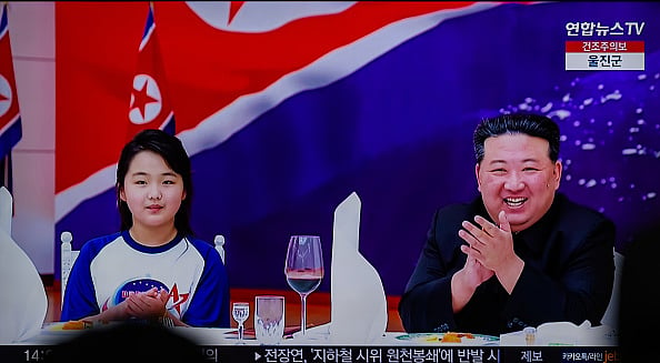 North Korean leader Kim Jong Un (R) and his daughter (L), believed to be named Kim Ju Ae - Getty Images